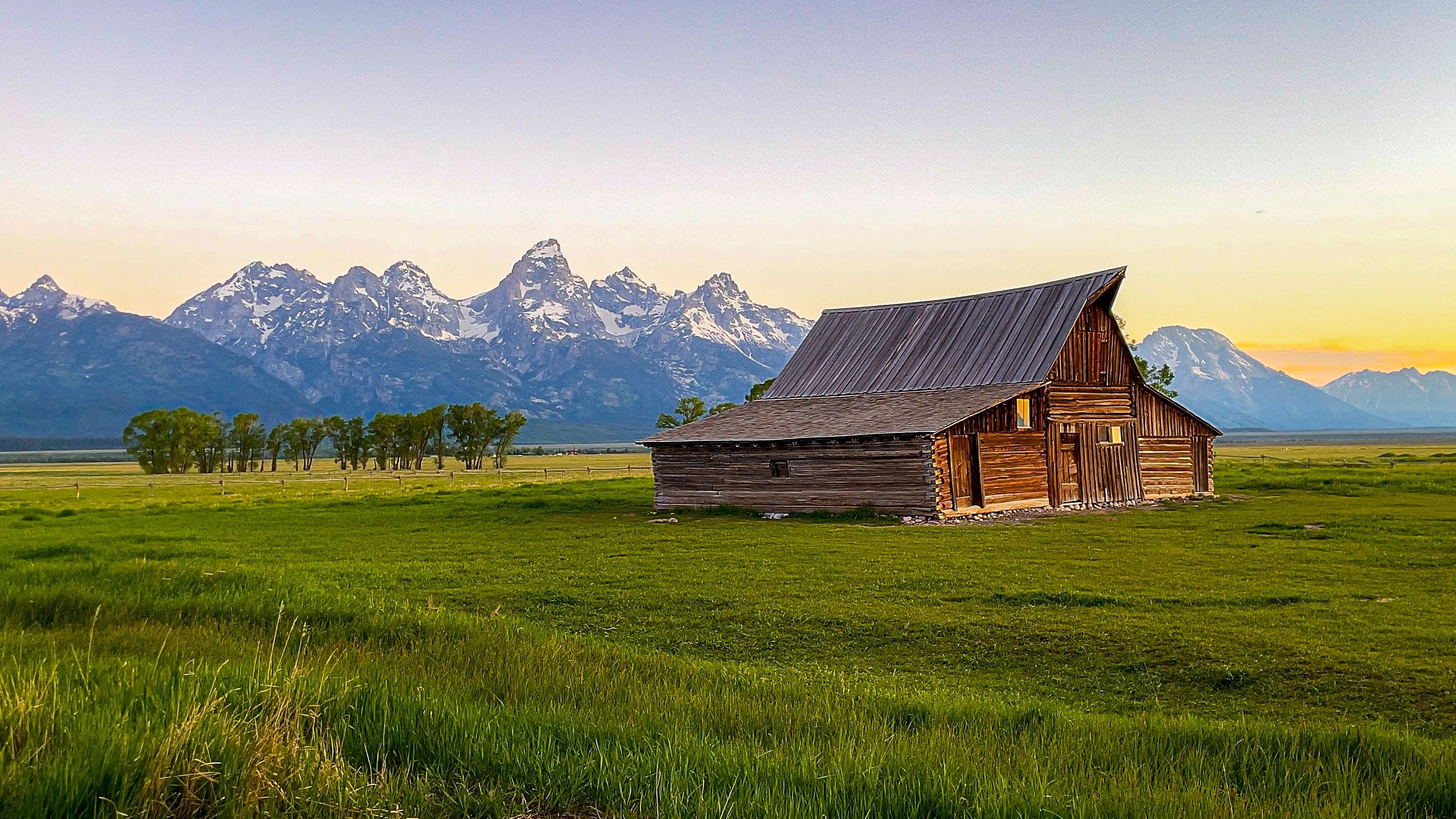 Rustic barn in mountain meadow
